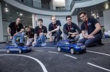 At the Audi Autonomous Driving Cup, approximately 50 students from all over Germany competed for the best model car with piloted driving – in the picture, members of the teams of Karlsruhe Institute of Technology (left) and the Technical University of Munich (right)